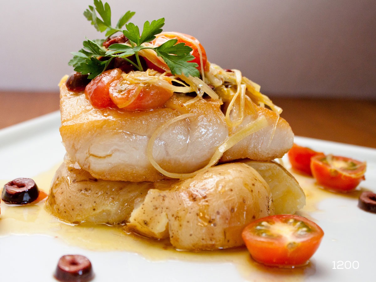 baked fish with potatoes and cherry tomatoes